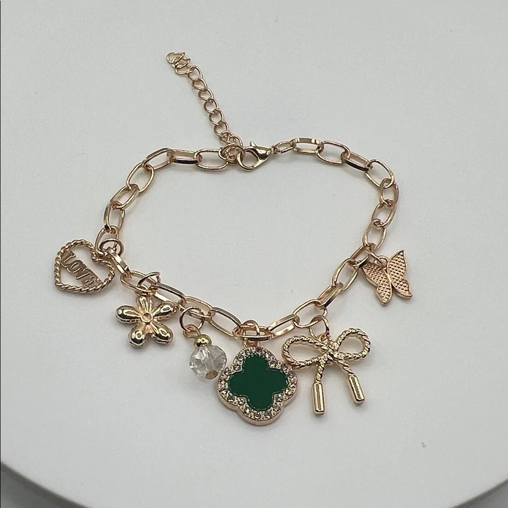 855. Gold Charm Bracelet with Green Clover